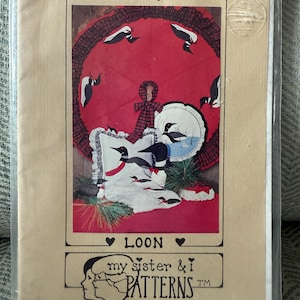 May include: A craft pattern package titled "Birds' Beasts Appliques". The design features a red circular motif with black and white birds. The word "LOON" is displayed, with "my sister & i PATTERNS" at the bottom. The package is encased in a clear plastic sleeve.