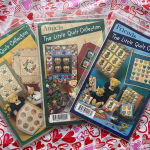 May include: Three quilt pattern books with colorful covers. The titles are "Parties The Little Quilt Collection", "Angels The Little Quilt Collection", and "Friends The Little Quilt Collection".