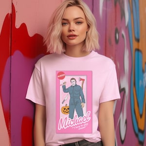 Michael doll tshirt, horror movie doll tshirt, funny Halloween graphic tee, pink spooky shirt, retro aesthetic, scary characters