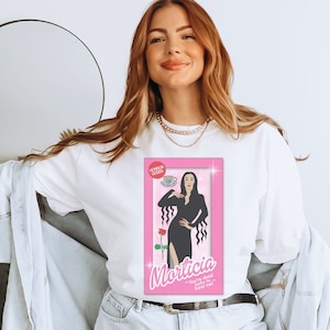 Morticia tshirt, horror movie doll tshirt, funny Halloween graphic tee, pink spooky shirt, retro aesthetic, scary characters, Addams family