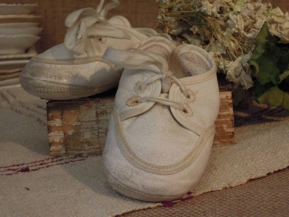 white leather baby shoes