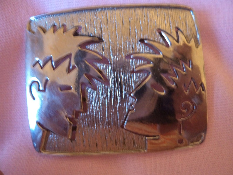 Vintage Signed JJ Silvertone Talking Heads Brooch/Pin image 1