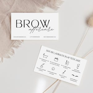 May include: A white card with the text "BROW aftercare" in black. The card also includes a list of instructions for brow lamination aftercare, including avoiding water, heat, and certain products. The instructions are illustrated with simple black and white icons.