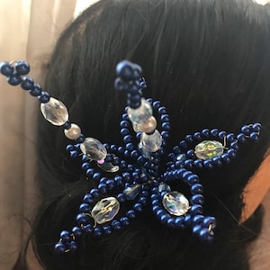 Temblque en forma de flor azul