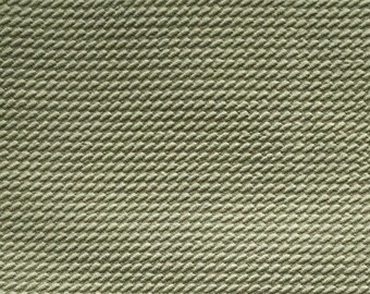 May include: A close-up of a textured fabric with a diagonal pattern. The fabric is a light green color.