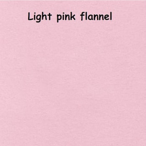 May include: A solid light pink flannel fabric with a soft, brushed texture. The text "Light pink flannel" is printed in black, sans-serif letters at the top centre of the image, clearly identifying the material and its colour for the viewer.