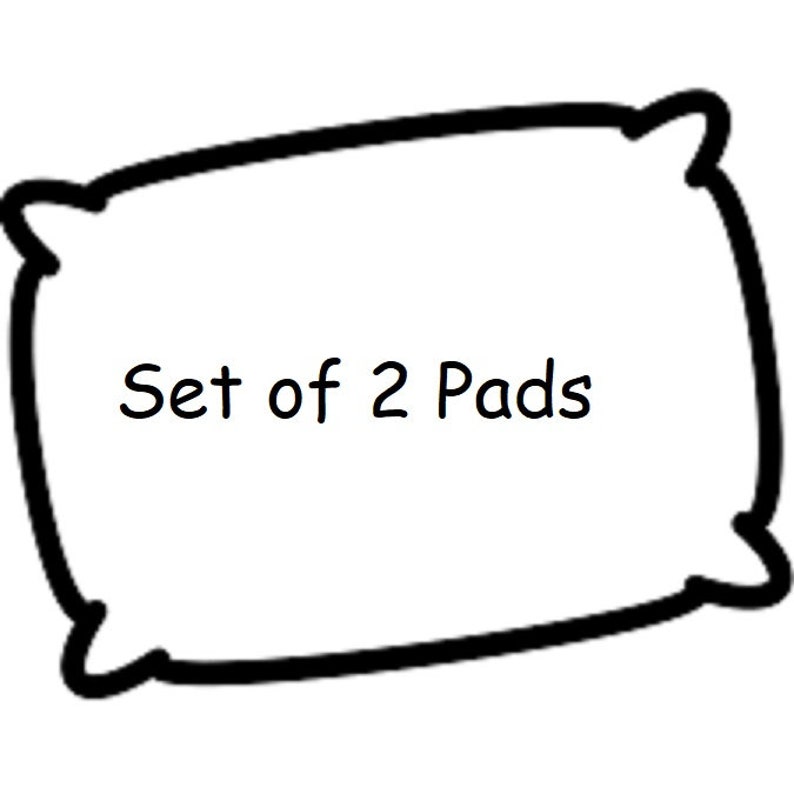 Puede incluir: Una almohada blanca con un contorno negro, con el texto "Set of 2 Pads". La almohada tiene forma rectangular con esquinas redondeadas. La imagen es simple y limpia, adecuada para varios listados de productos.