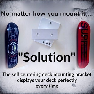 DKMounts   &quot; Solution &quot;   Skateboard Deck self centering Wall Mount Bracket. The DKM-2 takes the difficulty of hanging your deck straight
