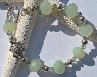Soft green new jade Turtle bracelet set with green faceted crystals and sterling silver beads and clasp