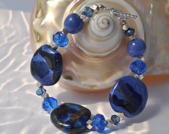 Brillant Blue African Kazuri Ceramic bracelet, with blue crystals and faceted sterling silver beads