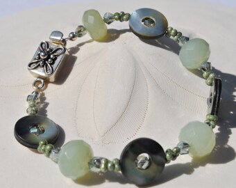 Black lip pearl soft green jade crystals bracelet accented with floral sterling silver clasp