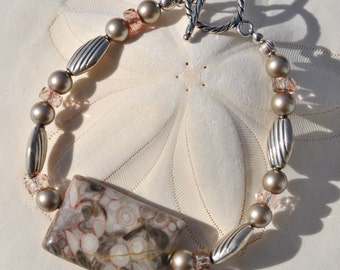 Rectangular Criniod fossil stone bracelet set with barely pink crystals, Bali sterling silver beads and silver pearls.