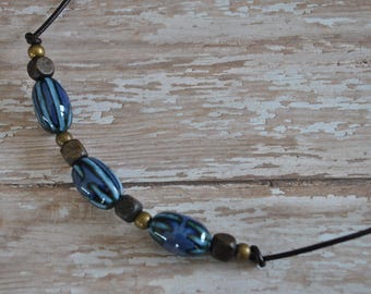 Men's Necklace of cobalt blue ceramic beads on brown leather cord, rugged, masculine