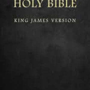 May include: A black book cover with the words "HOLY BIBLE" and "KING JAMES VERSION" in gold lettering. A small gold cross is at the bottom. The background has a textured, dark appearance.