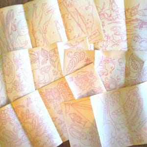 May include: A collection of vintage paper ephemera with pink line drawings. The drawings depict various scenes, including figures, flowers, and animals. The paper has a yellowed, aged appearance, suggesting its antique nature.