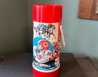 Termo vintage Aladdin con temática deportiva retro de los años 80