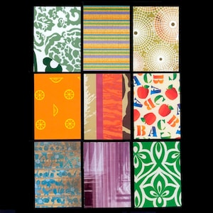 May include: Nine rectangular patterned designs in various colours. The patterns include green floral, orange stripes, white circles, orange citrus, red and orange stripes, apple and letter print, blue and gold, purple vertical stripes, and green floral.