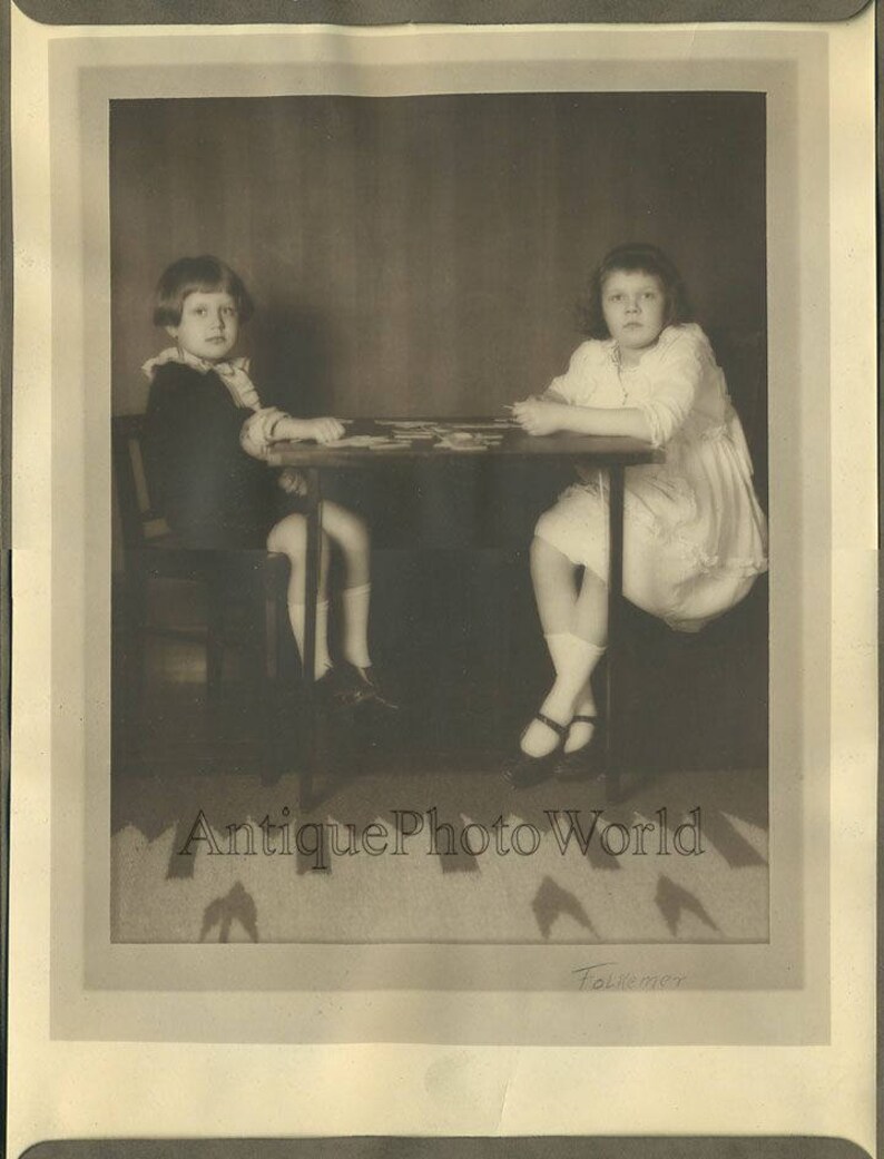 Children playing card game antique art photo
