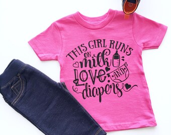This Girl Runs On Milk Love And Diapers Shirt, Funny Toddler TShirts, Tee Shirts For Toddlers, Girls Graphic Shirts, Trendy Kids Shirts