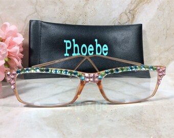 DAZZLING READERS with Aqua and Pink Crystals. Designer style in a Peach colored frame. FREE Faux Leather Case with a Name. +2.00