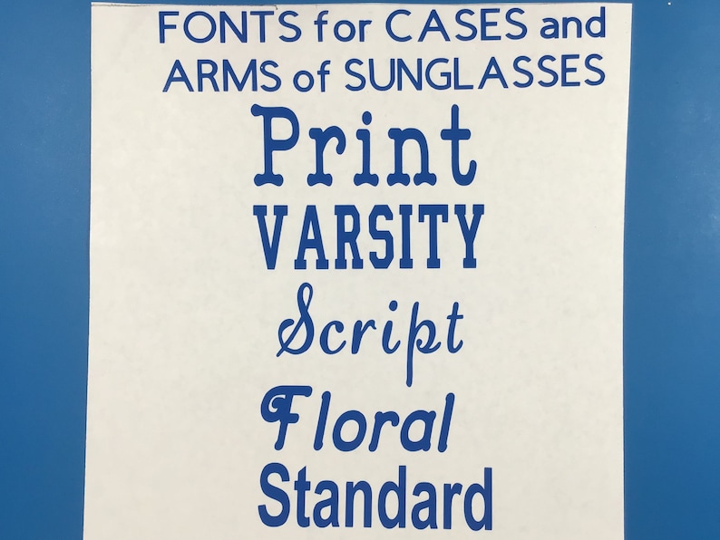 May include: A white sheet of paper with blue text that reads "FONTS for CASES and ARMS of SUNGLASSES" followed by the words "Print", "Varsity", "Script", "Floral", and "Standard".