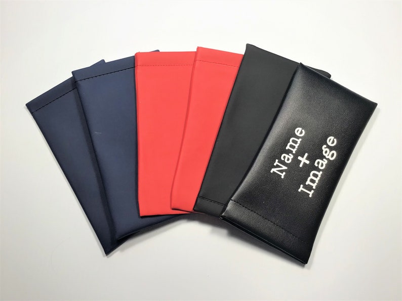 May include: Five different colored fabric pouches, with the top pouch being black and having the text "Name + Image" embroidered on it in white.