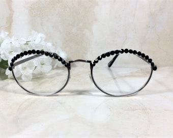 GENUINE BLACK CRYSTALS are so pretty on this classic reader. High quality and clarity. Free Faux Leather Case with a Name. +2.00