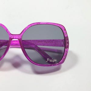GIRLS PERSONALIZED SUNGLASSES Engraved with a Name. Glitter embedded in the frame plus rhinestones. Purple