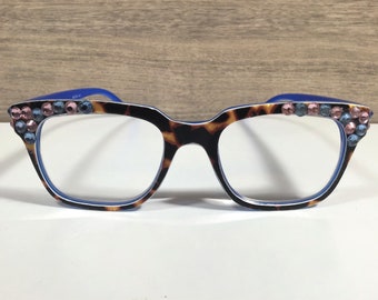 BLUE/GOLD CRYSTALS enhance the beauty of this reader. Tortoise shell frame. Free Faux Leather Case with a Name included in purchase. +2.50