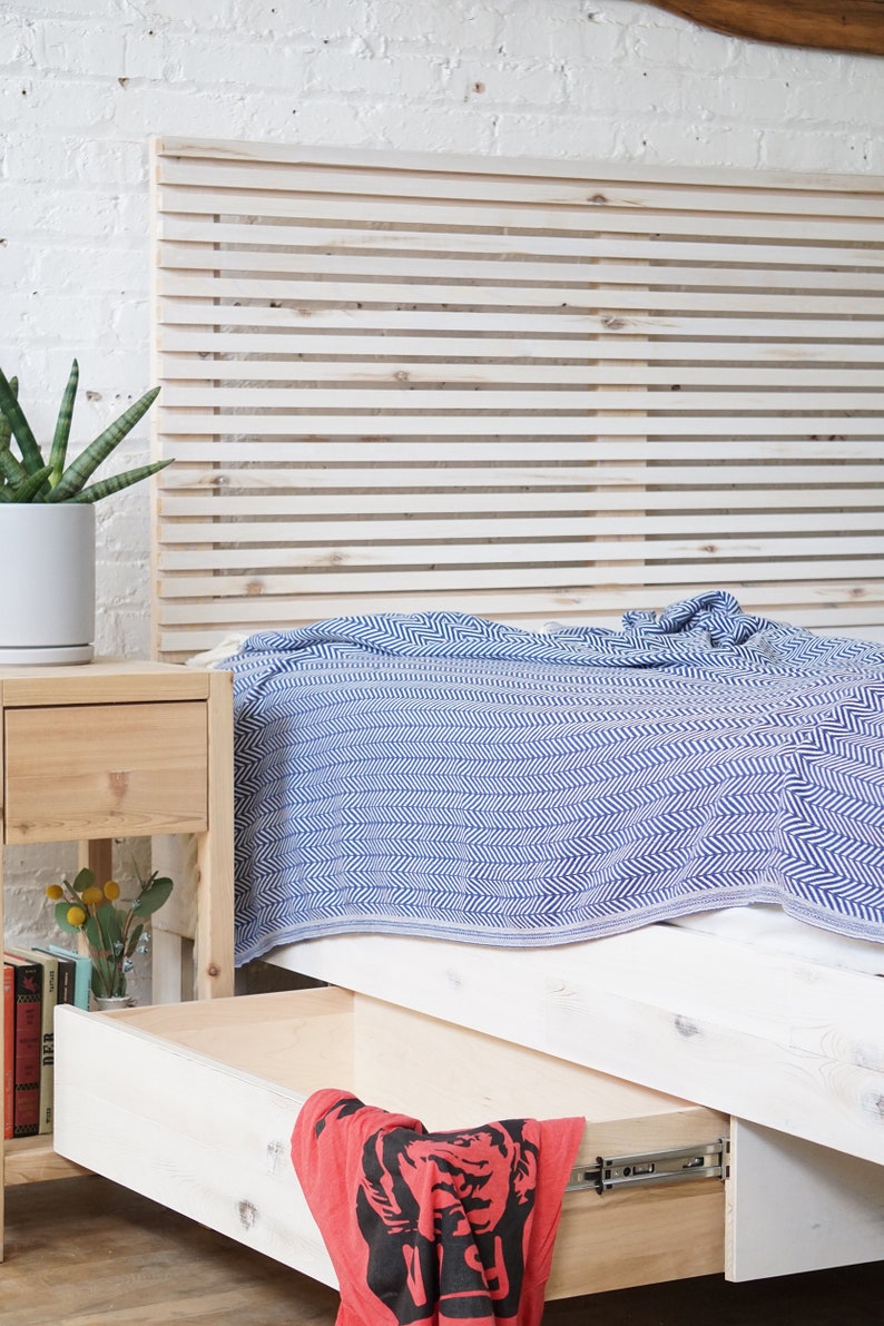 Natural solid wood platform bed frame with storage drawers. Modern, rustic design. Made in the USA. Sustainably sourced materials. Heirloom quality furniture. Bedroom. Headboard. Home storage.