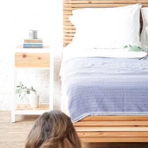 Natural solid wood platform bed frame with storage drawers. Modern, rustic design. Made in the USA. Sustainably sourced materials. Heirloom quality furniture. Bedroom. Headboard. Home storage.