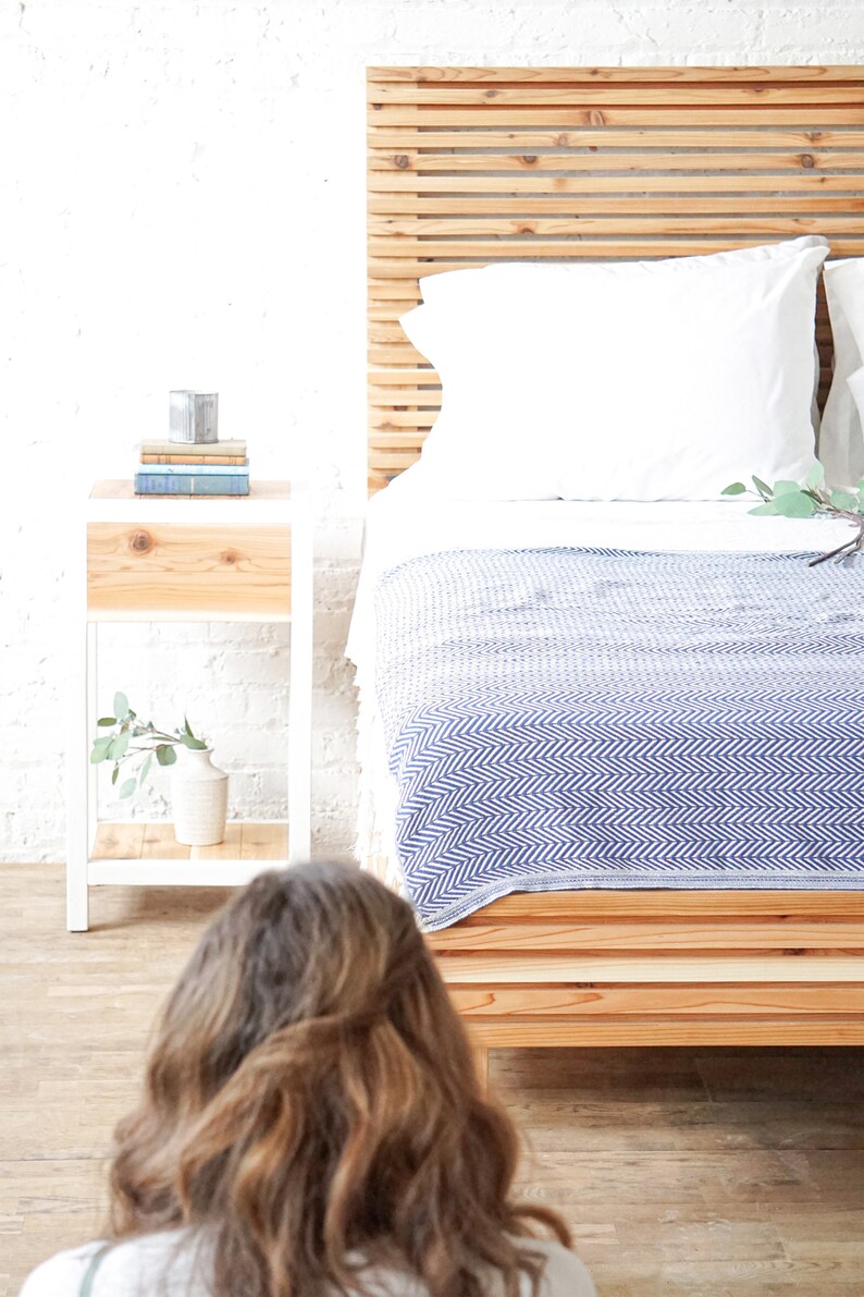 Natural solid wood platform bed frame with storage drawers. Modern, rustic design. Made in the USA. Sustainably sourced materials. Heirloom quality furniture. Bedroom. Headboard. Home storage.