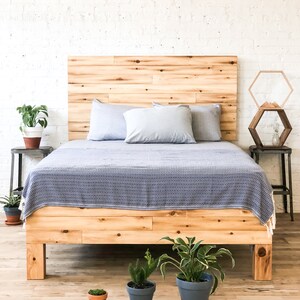 Platform bed frame and headboard set. Made of natural solid wood. Handcrafted in the USA. Heirloom quality furniture. Sustainably sourced materials. Farmhouse. Cottage. Barn wood style.