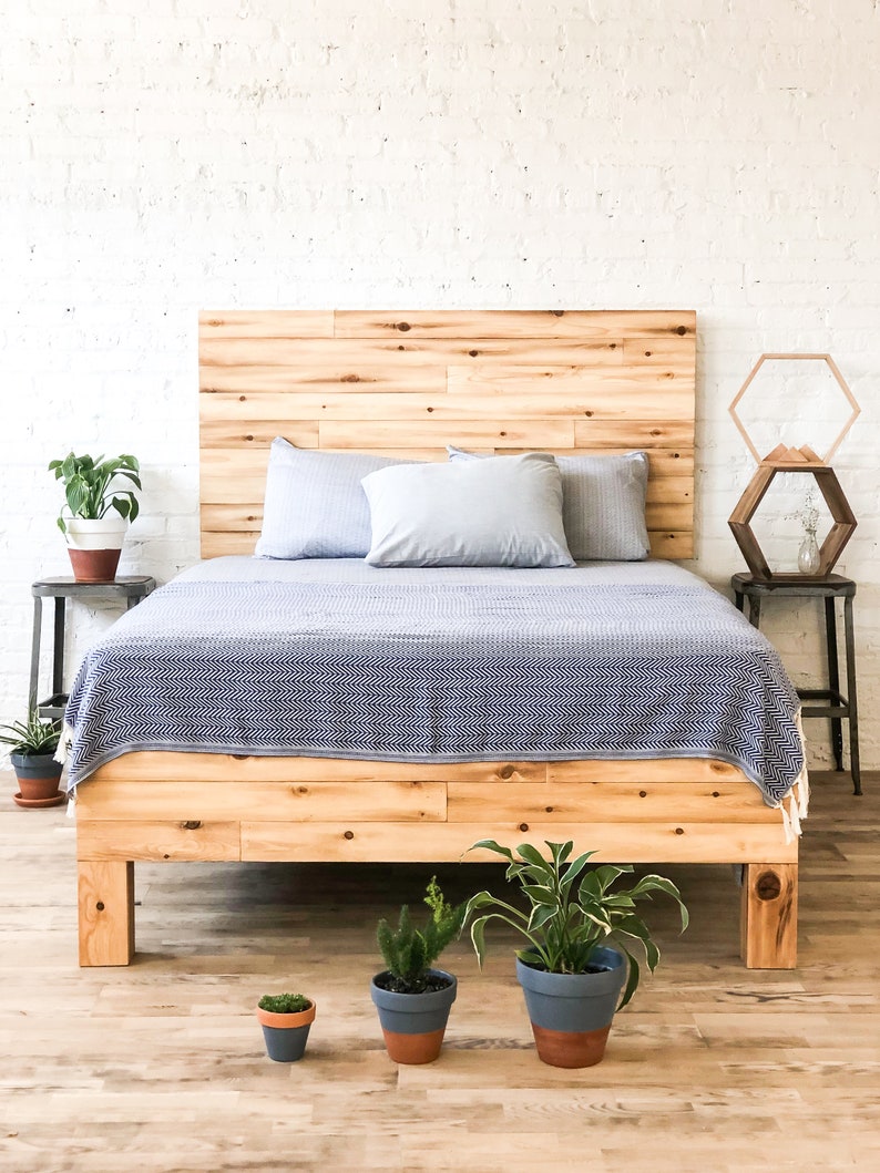 Platform bed frame and headboard set. Made of natural solid wood. Handcrafted in the USA. Heirloom quality furniture. Sustainably sourced materials. Farmhouse. Cottage. Barn wood style.