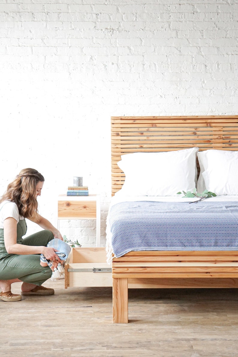 Natural solid wood platform bed frame with storage drawers. Modern, rustic design. Made in the USA. Sustainably sourced materials. Heirloom quality furniture. Bedroom. Headboard. Home storage.