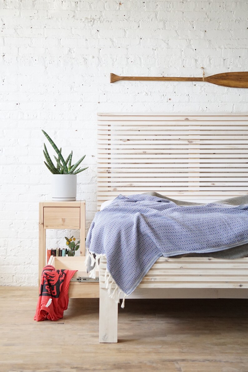 Natural solid wood platform bed frame with storage drawers. Modern, rustic design. Made in the USA. Sustainably sourced materials. Heirloom quality furniture. Bedroom. Headboard. Home storage.