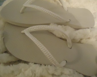 white pearl flip flops