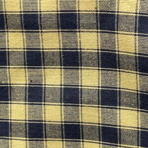 May include: A woven fabric featuring a repeating plaid pattern composed of dark navy blue and muted mustard yellow squares. The textile displays a visible grid structure with a consistent, tight weave throughout the entire surface area.