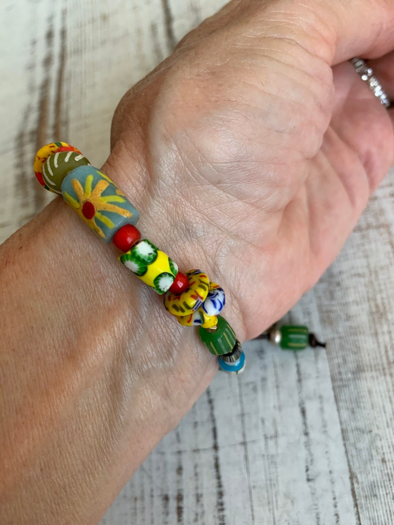 Sun Jewelry. African trade and recycled beads and artisan made button clasp and talisman charms OOAK bracelet by ladeDAH