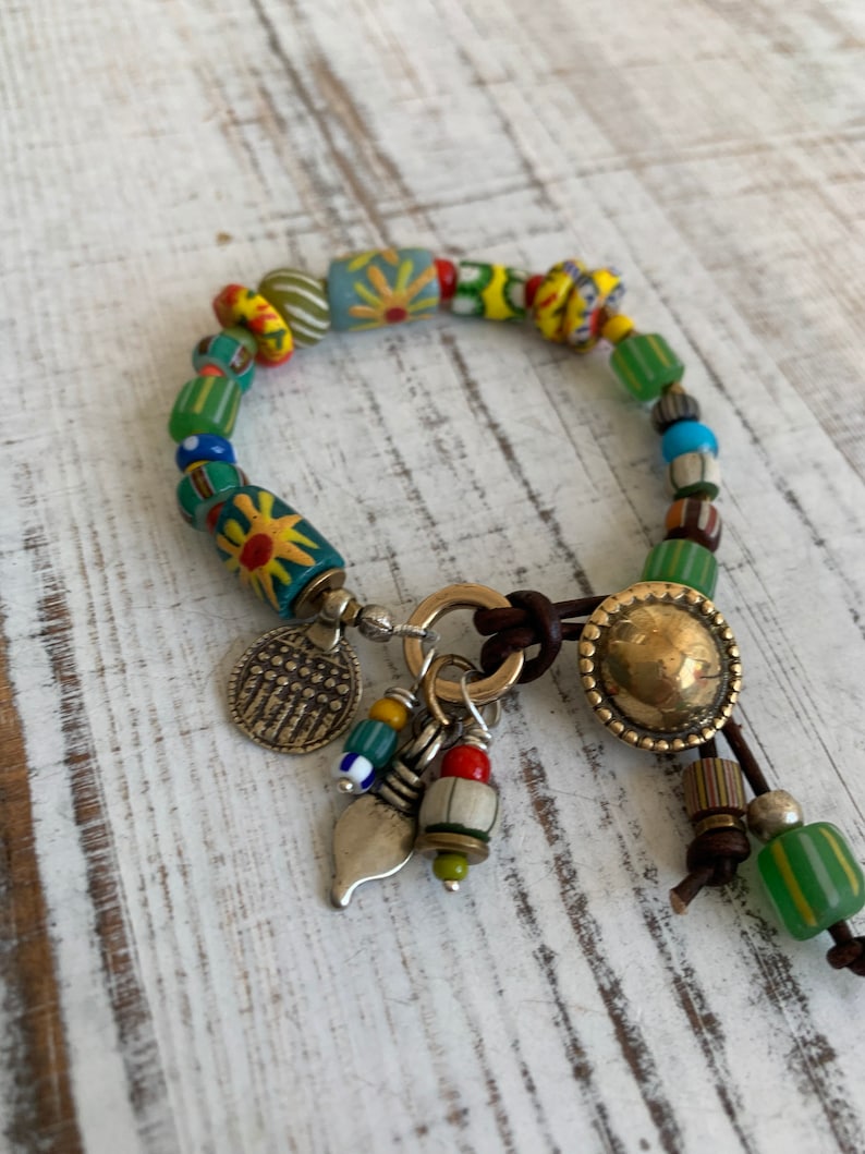 Sun Jewelry. African trade and recycled beads and artisan made button clasp and talisman charms OOAK bracelet by ladeDAH