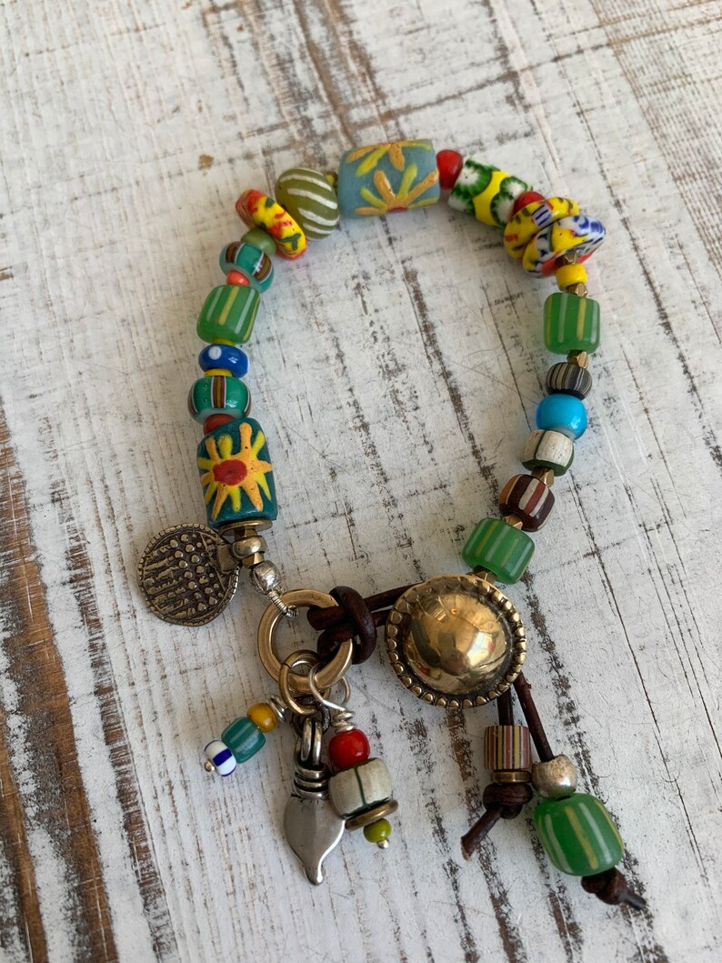 Sun Jewelry. African trade and recycled beads and artisan made button clasp and talisman charms OOAK bracelet by ladeDAH