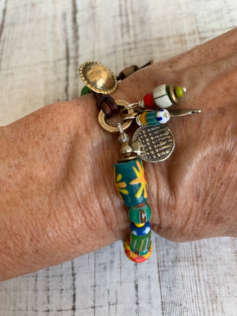 Sun Jewelry. African trade and recycled beads and artisan made button clasp and talisman charms OOAK bracelet by ladeDAH