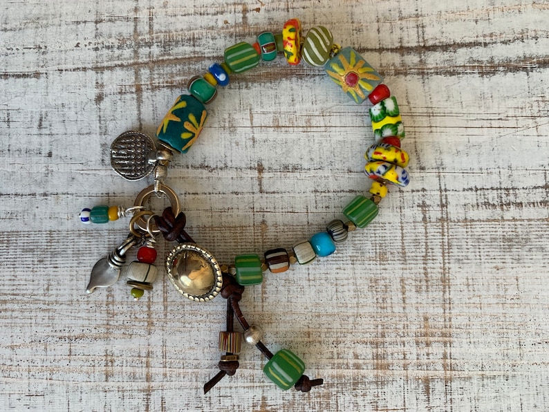 Sun Jewelry. African trade and recycled beads and artisan made button clasp and talisman charms OOAK bracelet by ladeDAH