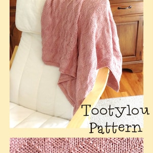 May include: A pink knitted blanket with a textured pattern, draped over a white armchair. The blanket is called "Tootylou Pattern".