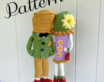 May include: Crocheted golf club covers in the shape of a couple, one in a green suit and the other in a purple dress. The covers have hats and are decorated with flowers. The word "Pattern" is written in cursive at the top.