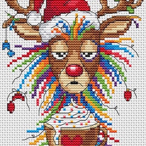 May include: Cross-stitch design of a reindeer wearing a Santa hat, with a red nose and tired eyes. The reindeer has colorful rainbow hair and is holding a cup of hot chocolate with whipped cream and a heart. Christmas themed.