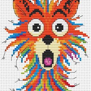 May include: A cross-stitch pattern of a surprised fox with large white eyes, a black nose, and an open mouth revealing a pink tongue. The fox has orange fur with colorful accents of blue, green, yellow, and purple.