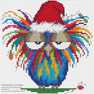 May include: A cross-stitch design of a colorful owl wearing a red Santa hat. The owl features a rainbow of colors in its feathers and a grumpy expression. The design includes a small carrot and a pink flower.