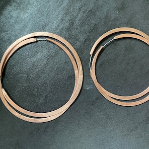 Primitive 3&quot; and 4&quot; lightly textured copper hoop earrings.