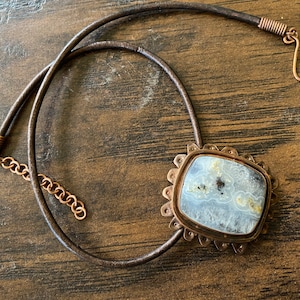 unisex copper and solar quartz square pendant necklace.